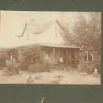 susan hart in front of wood house